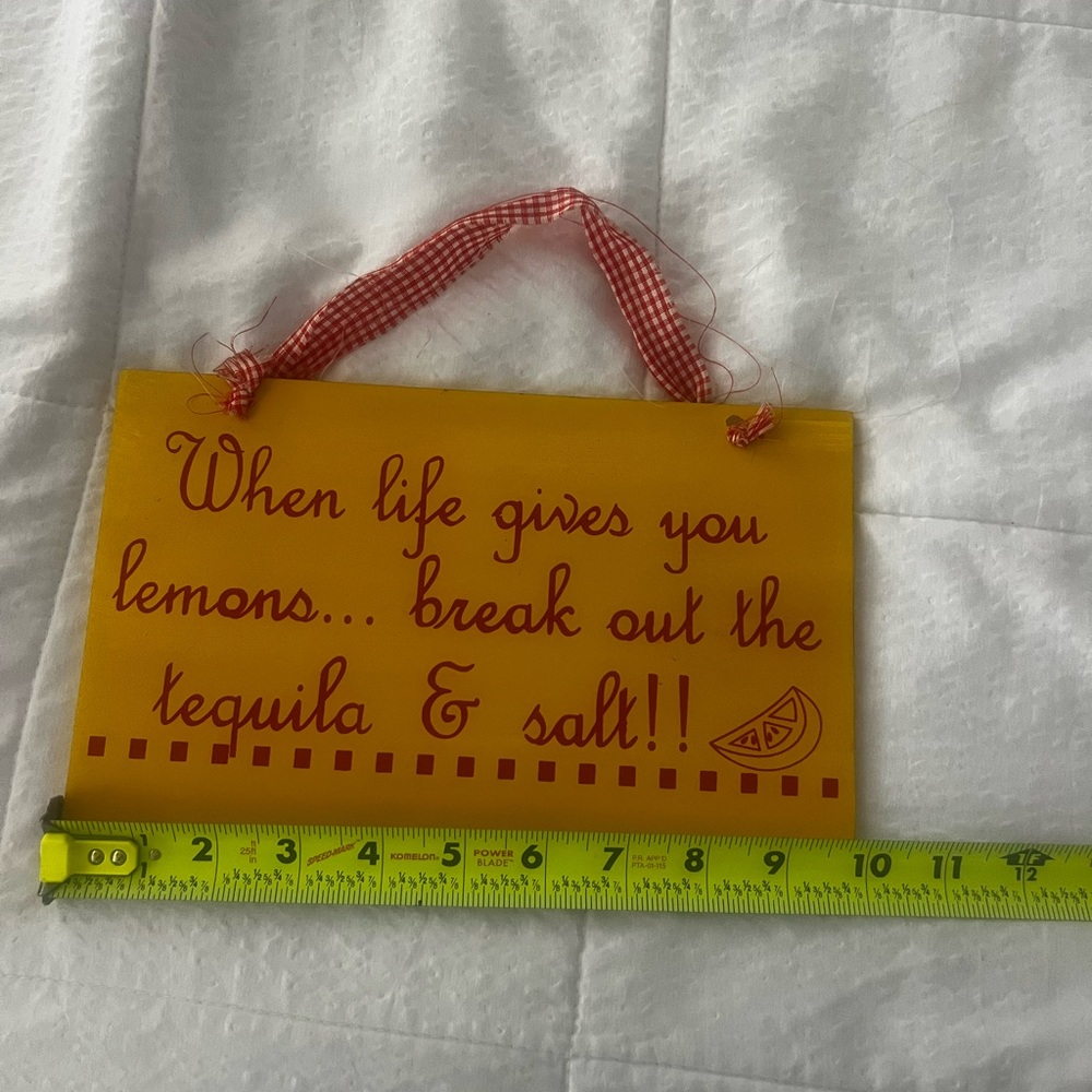Yellow Wall Sign with Red Text